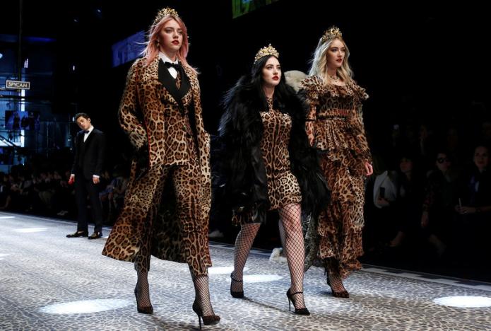 Women wearing leopard print at a runway