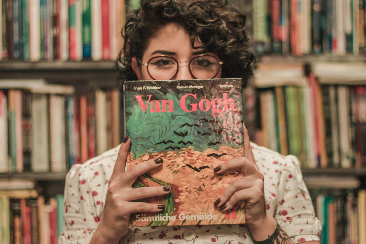 holding a Van Gogh book