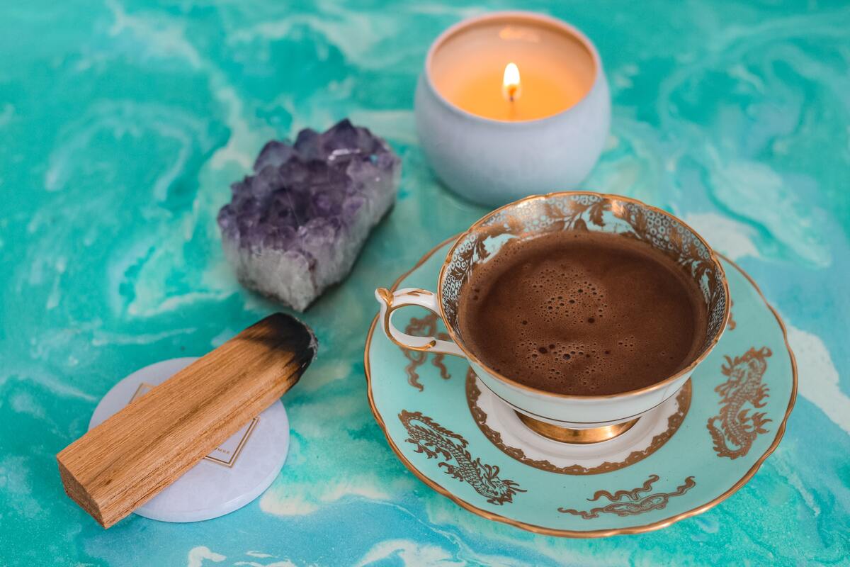 crystals with candle and tea