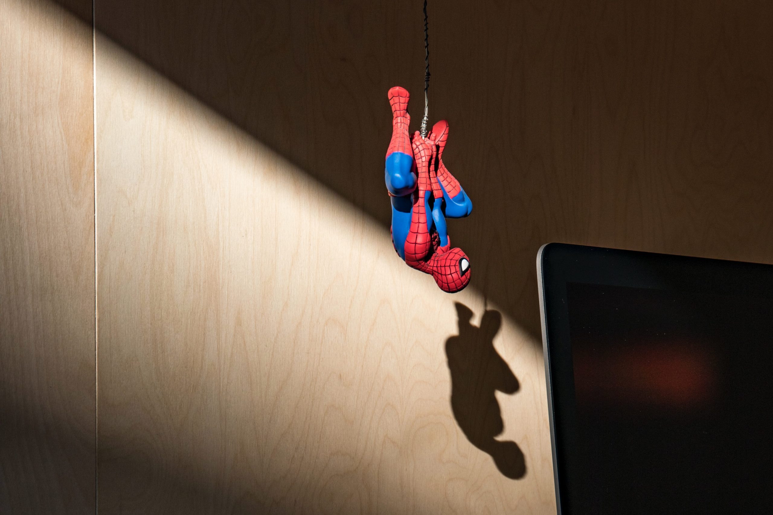 spiderman hanging upside down
