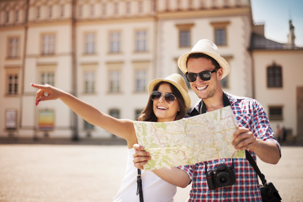 A couple of tourists sightseeing with a map