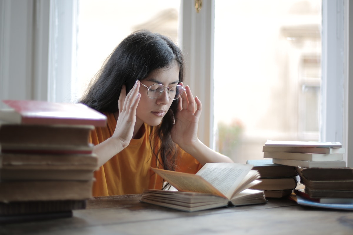 female student having a headache