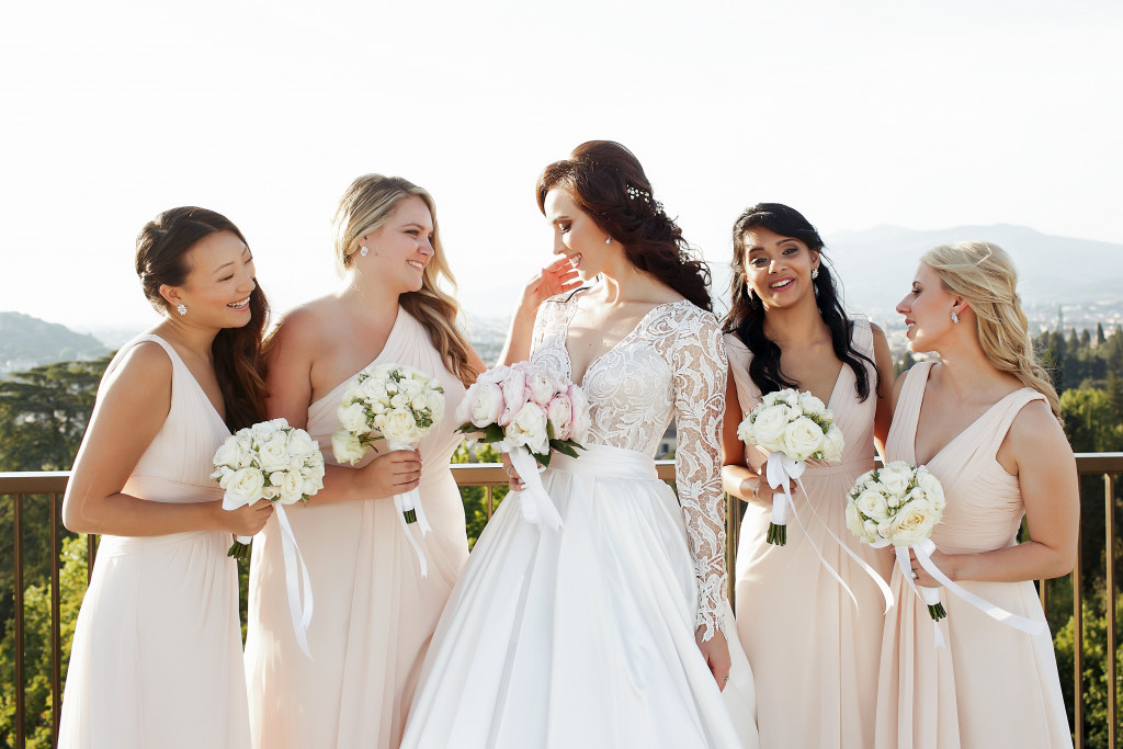 Bridesmaids and bride posing for a photo