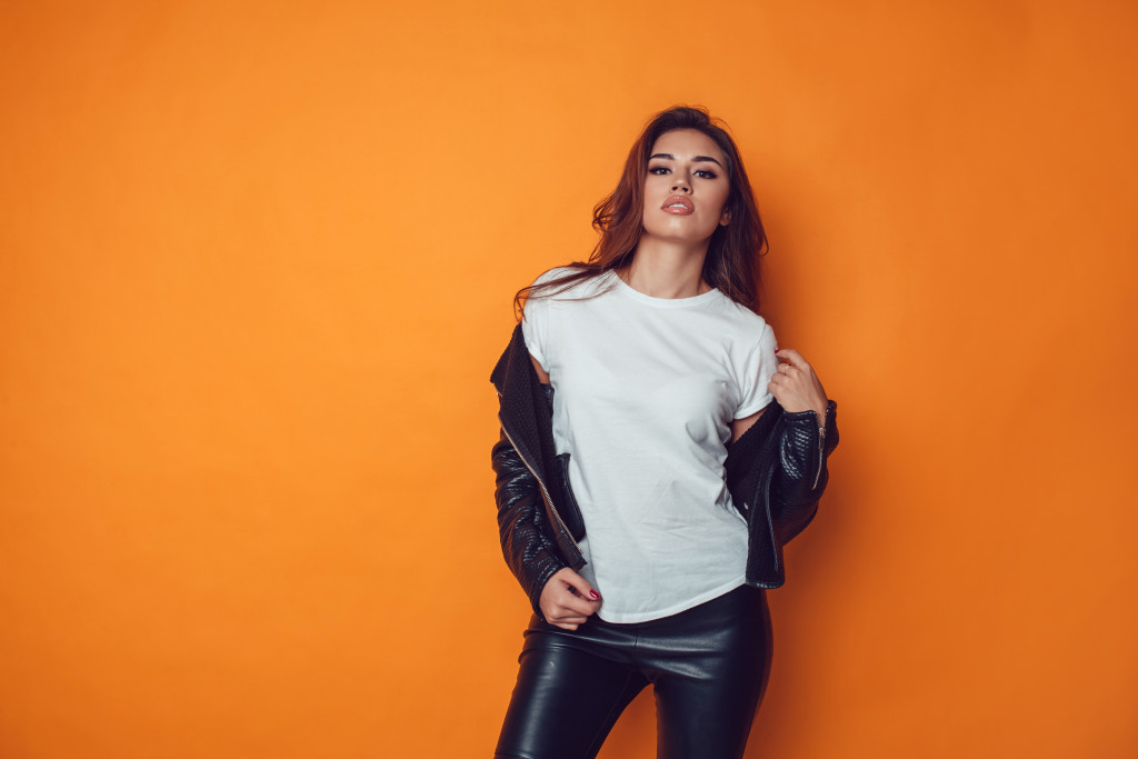 woman with plain shirt and leather jacket