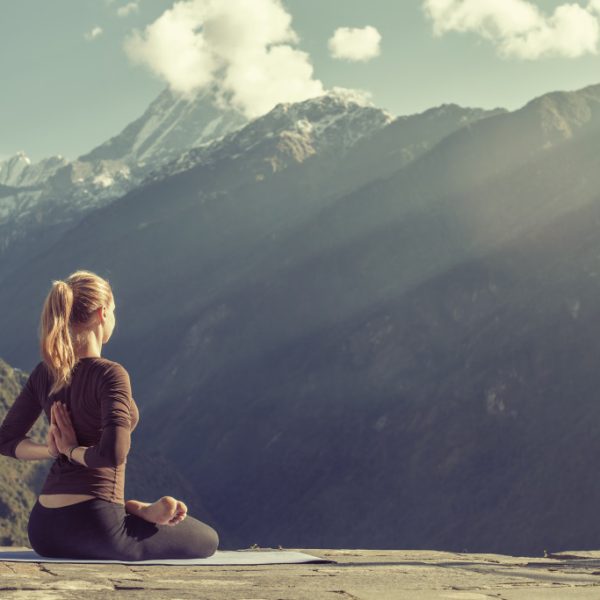 woman meditating outdoors
