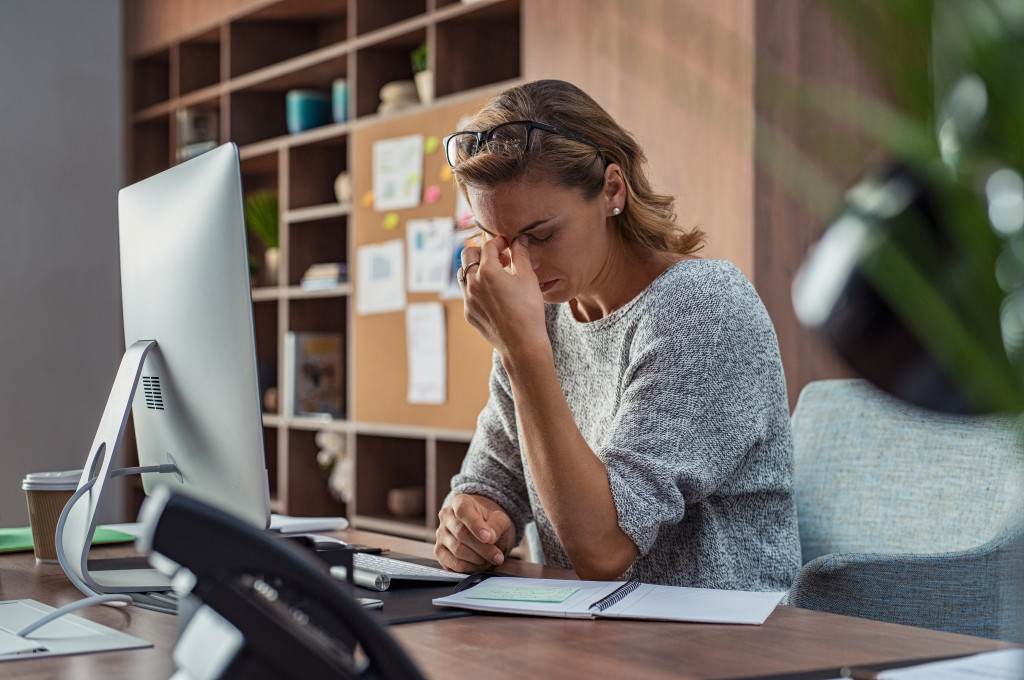 Stressed woman at work